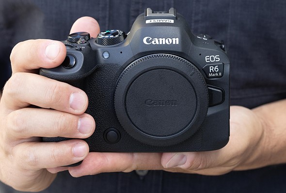hands holding Canon EOS R6 II