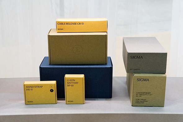 Sigma camera and lens boxes on display