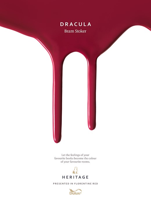 red paint drips down a white page with small text