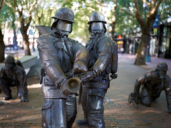 Seattle firefighter statue in pioneer square