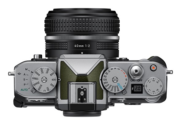 a silver camera with green accents is placed on a white background
