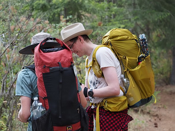 two_backpackers_consulting_a_map