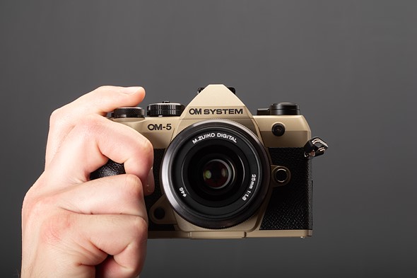 OM-5 II in hand front