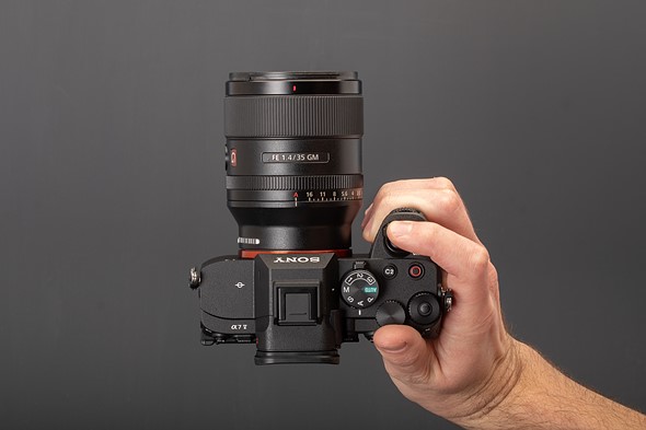 Sony a7V in-hand top down