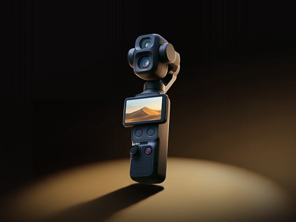 dji camera gimabl stands against a dark background with a spotlight