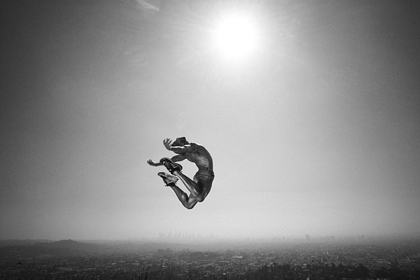 L1002856 - JOSHUA ROSE - curled up flying in the sky with sun